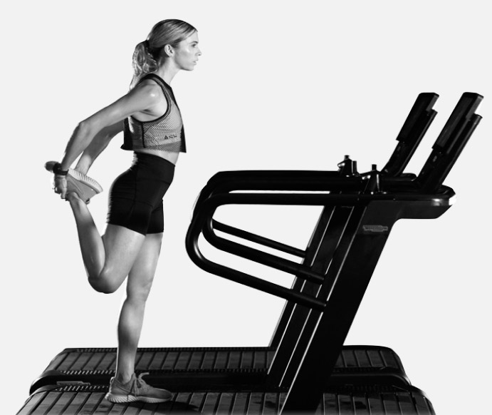 Person stretching on a treadmill