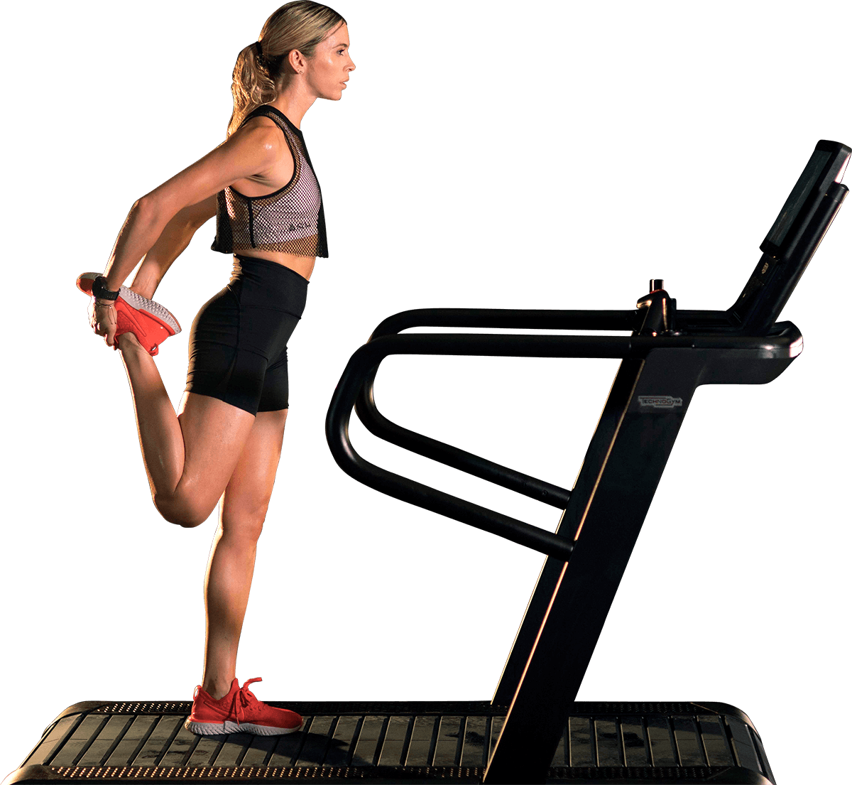 Woman stretching while standing on a treadmill